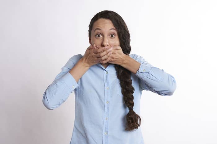 euphemism examples woman covering mouth